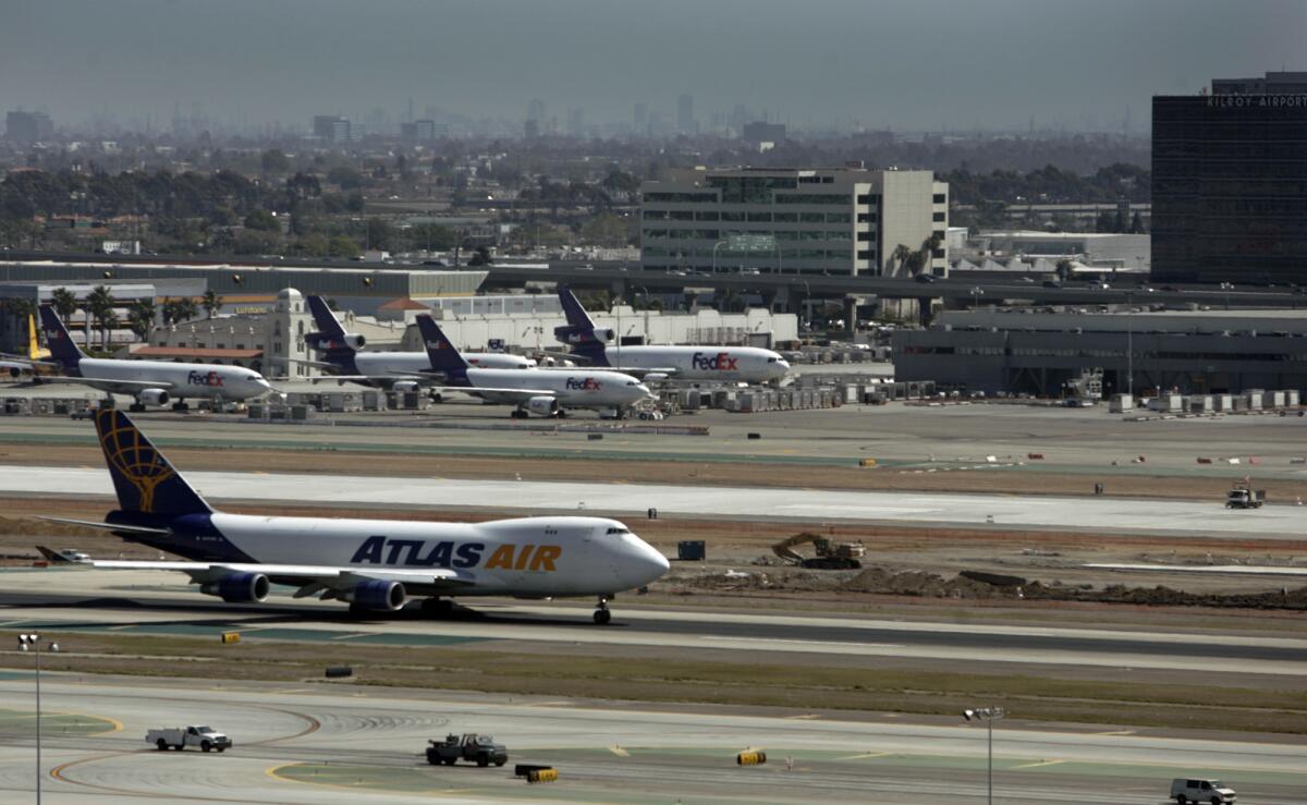 Aircraft operate on the reconfigured south runway complex at LAX, which is now the focus of a lawsuit over construction defects.