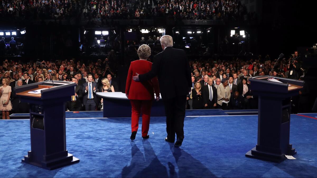 Hillary Clinton and Donald Trump greet the audience at the end of the first presidential debate at Hofstra University in Hempstead, New York on Sept. 26.
