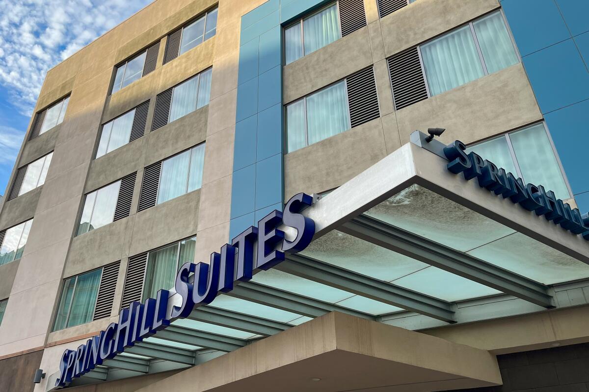 A hotel façade with a sign that reads SpringHill Suites