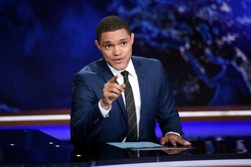 In this Sept. 29, 2015, file photo, Trevor Noah tapes "The Daily Show With Trevor Noah" in New York. Noah on Thursday night called for acknowledgment of the systemic racism within law enforcement.