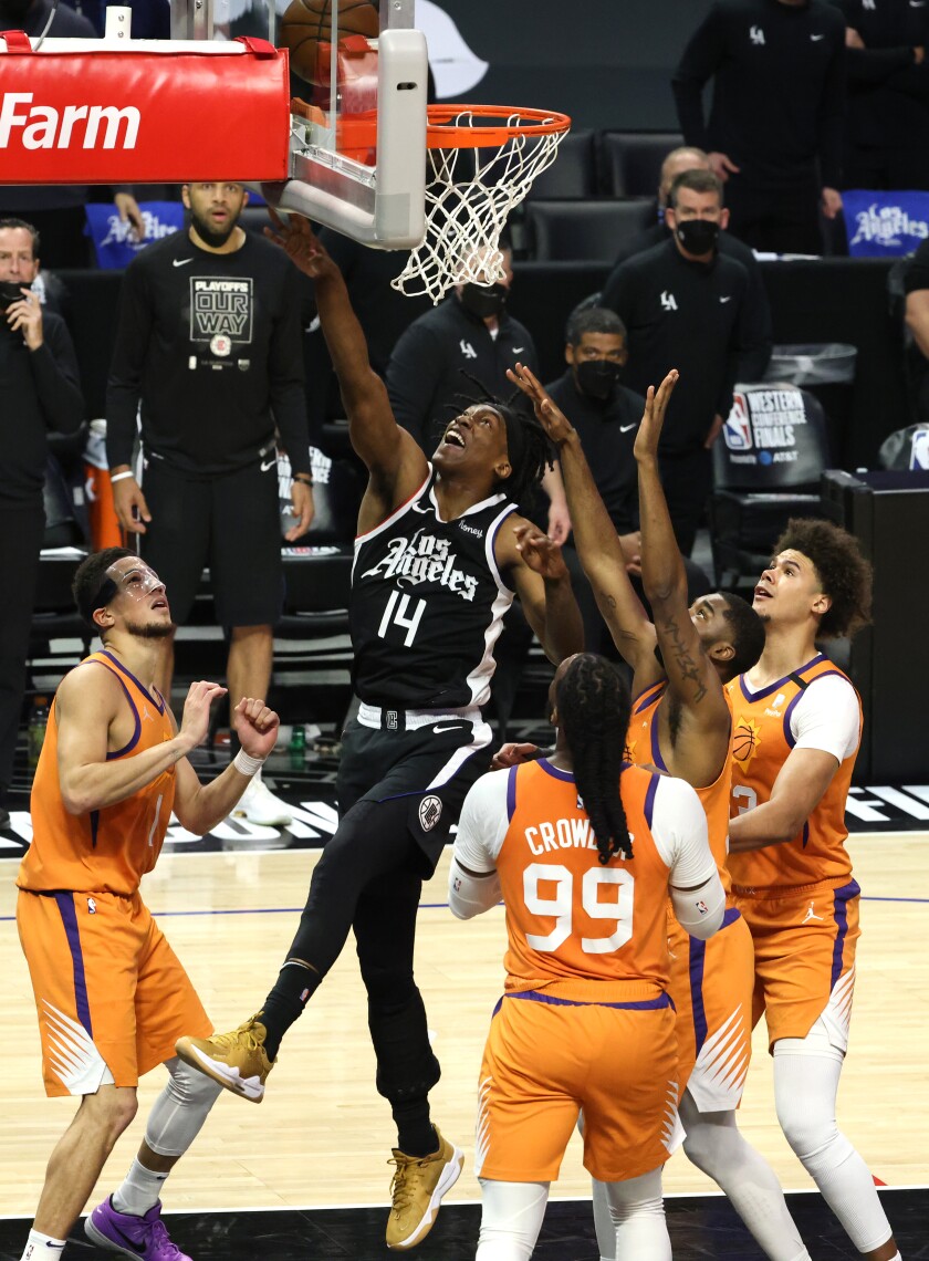 Clippers guard Terance Mann scores on a put-back against the Suns in Game 3.