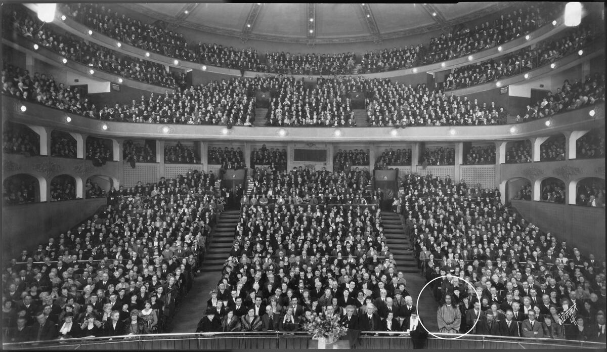 A packed Los Angeles Philharmonic Auditorium in 1925 with one person circled 