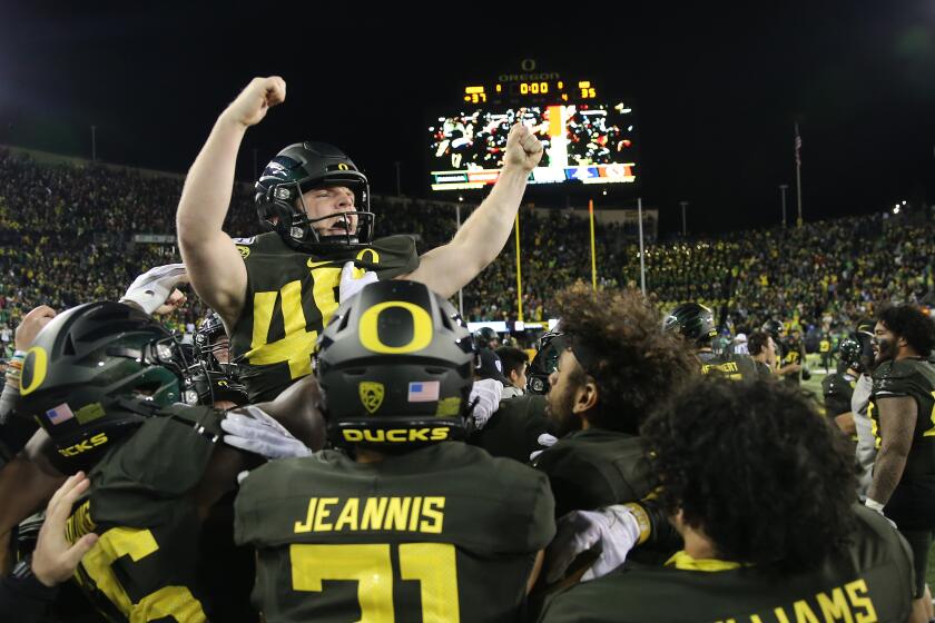 EUGENE, OREGON - OCTOBER 26: Camden Lewis #49 of the Oregon Ducks celebrates with teammates after kicking the game winning field goal to defeat the Washington State Cougars 37-35 during their game at Autzen Stadium on October 26, 2019 in Eugene, Oregon. (Photo by Abbie Parr/Getty Images)