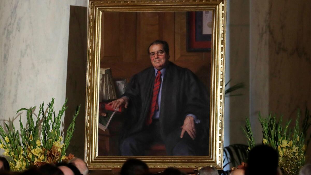 A portrait of the late Supreme Court Justice Antonin Scalia is displayed during a memorial 