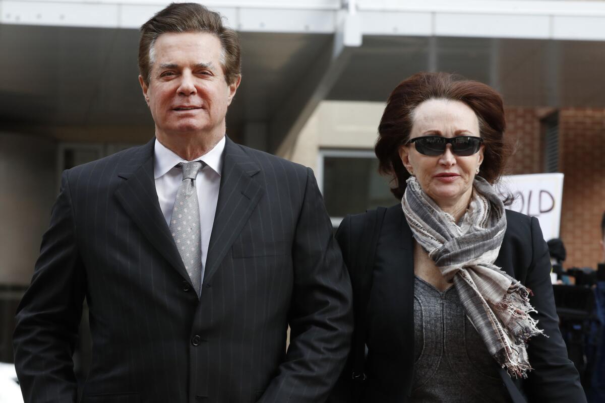 Former Trump campaign chairman Paul Manafort arrives with his wife, Kathleen Manafort, at court in Alexandria, Va., on March 8.