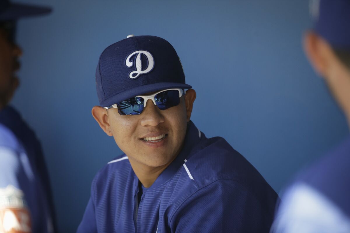 Pitcher Julio Urias in the Dodgers dugout during a spring training game against the Milwaukee Brewers in Phoenix on March 14, 2016.