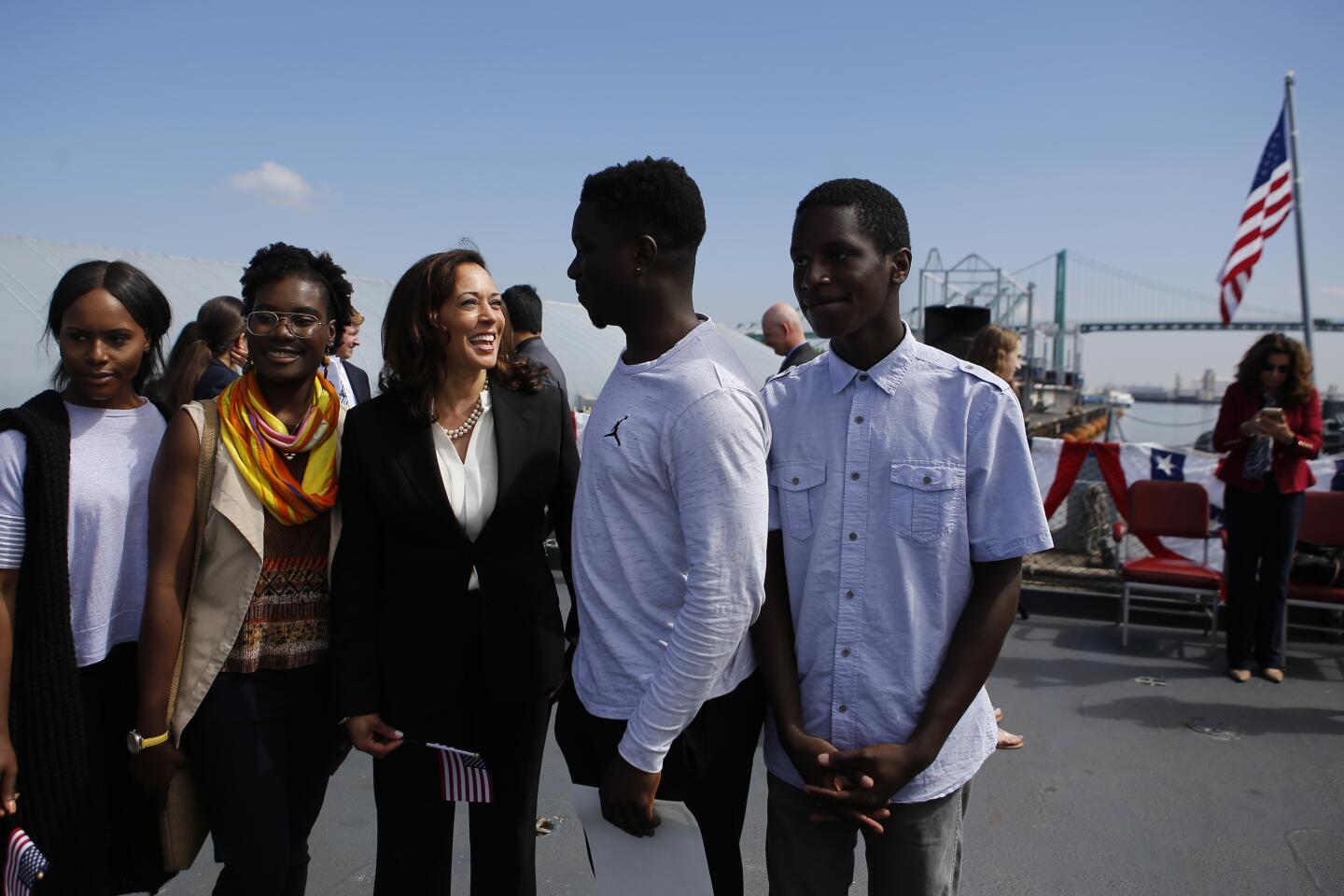 Kamala Harris greets people who were sworn in as citizens in a ceremony on the battleship Iowa in Los Angeles in 2017.