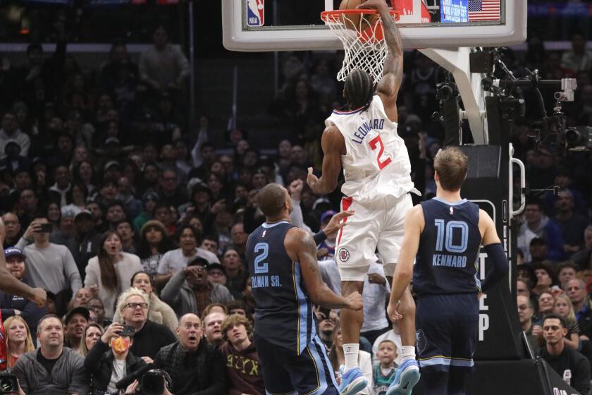 LOS ANGELES, CA - MARCH 05: Kawhi Leonard's dunk in the fourth quarter gave the Clippers a 122-121 lead over the Memphis Grizzlies at Crypto.com Arena in Los Angeles, CA on Sunday, March 5, 2023. (Myung J. Chun / Los Angeles Times)