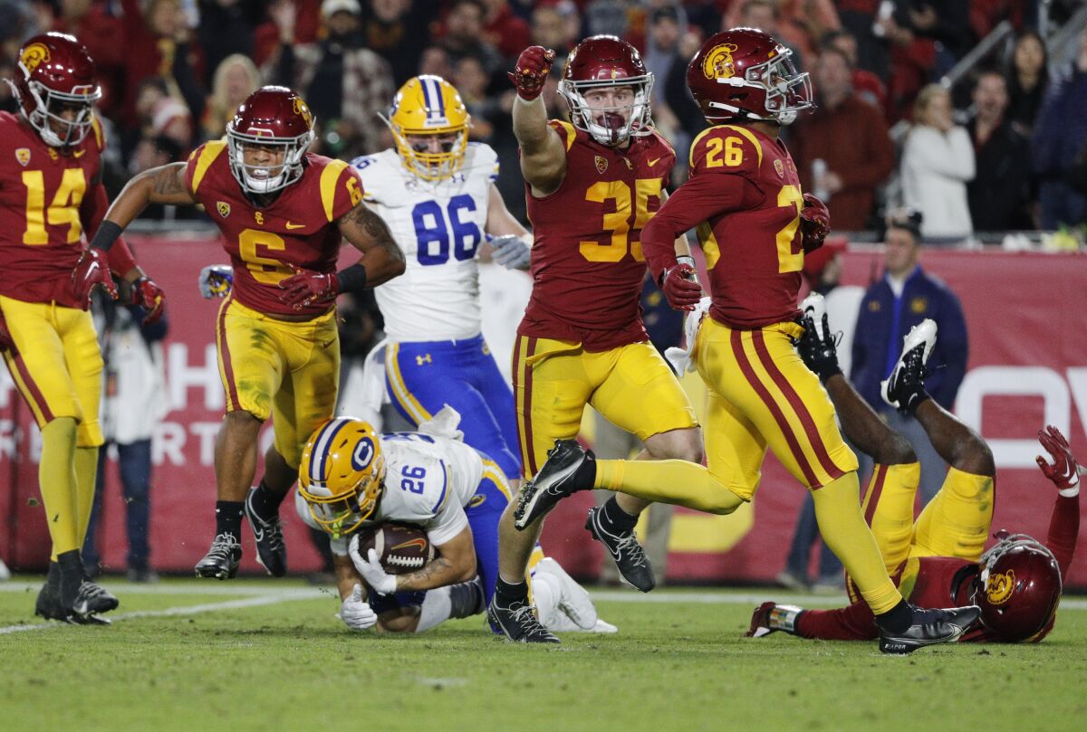 USC's Mekhi Blackmon and Clyde Moore react after Blackmon tackled California running back Ashton Hayes.