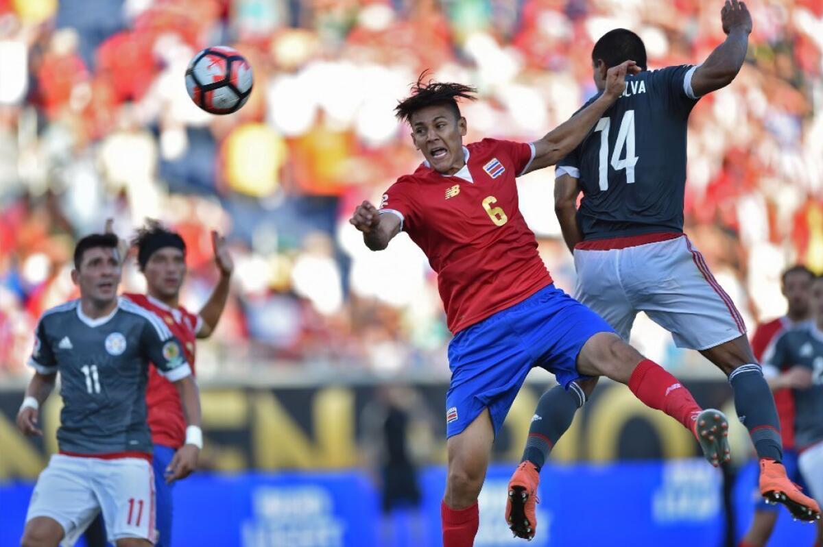 Costa Rica's Oscar Duarte and Paraguay's Paulo Cesar Da Silva vie for the ball during a Copa America Centenario match on June 4.