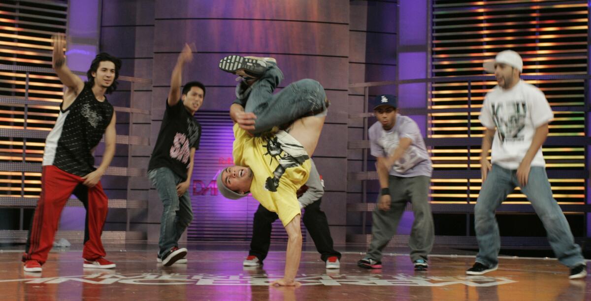 Ronnie Abaldonado goes up on one hand while reahearsing with Super Cr3w -- winners of Season 2 of "America's Best Dance Crew" -- while on the set.