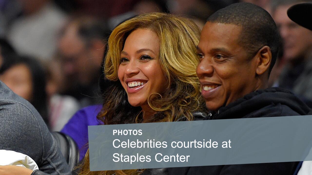 Recording artists Beyonce, left, and Jay-Z watch the Clippers play the Brooklyn Nets at Staples Center on Jan. 22, 2015.