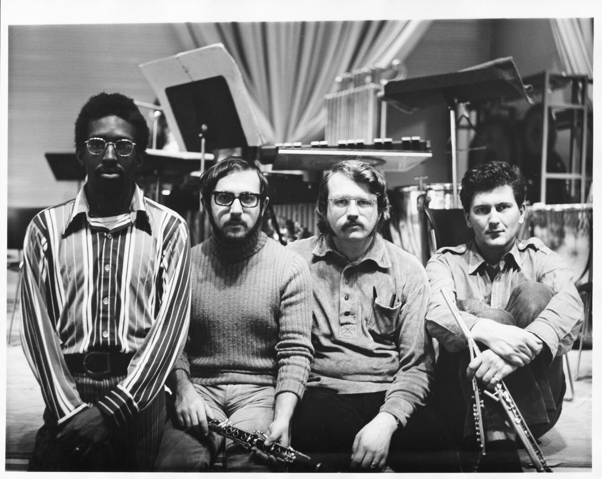 Julius Eastman sits beside other S.E.M. Ensemble members.