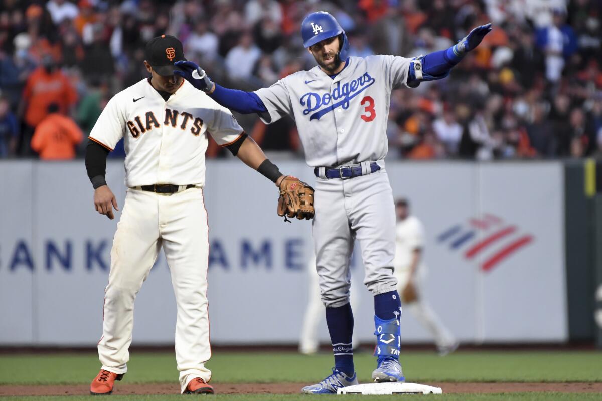 Two baseball players on a baseball field