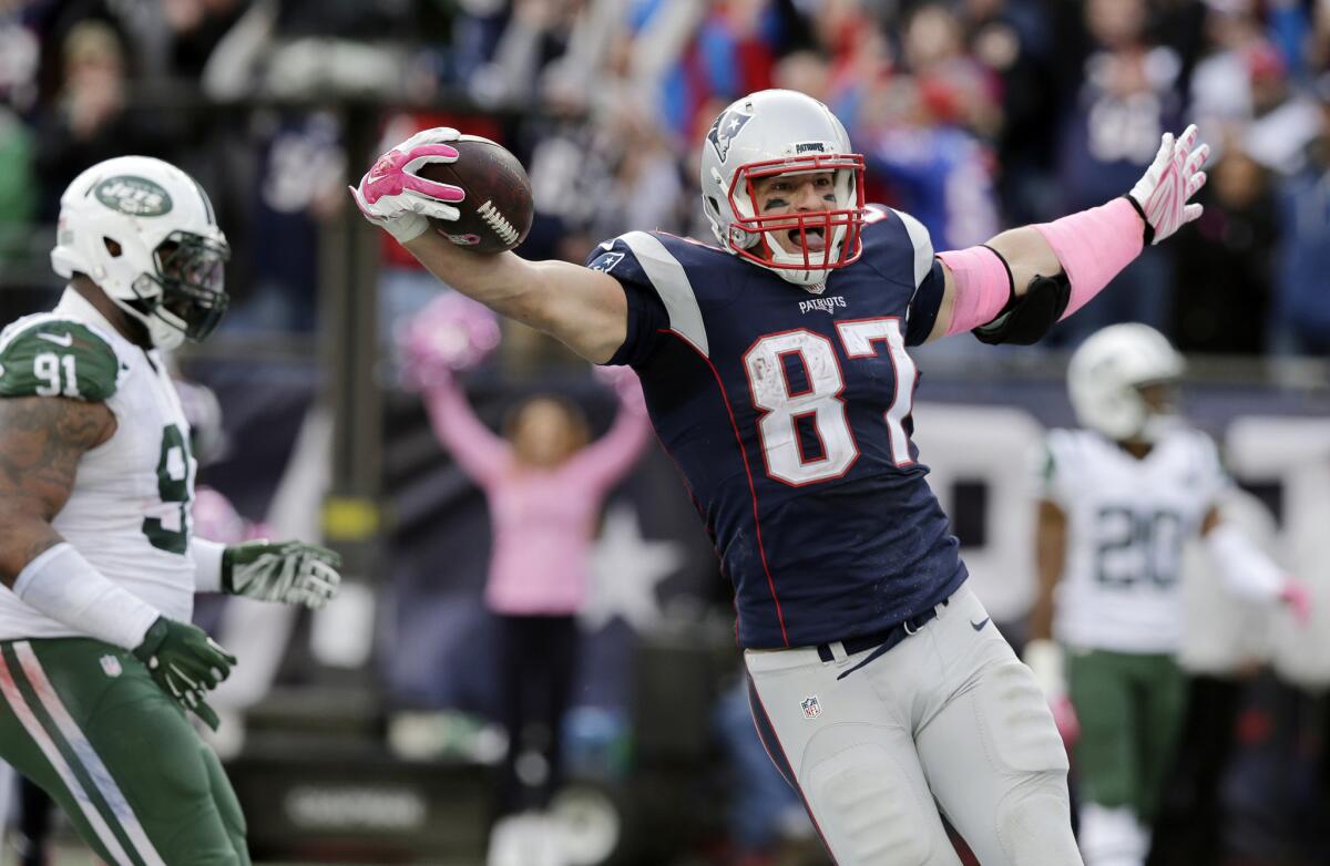 Patriots tight end Rob Gronkowski (87) celebrates his touchdown catch against the Jets in the second half Sunday.
