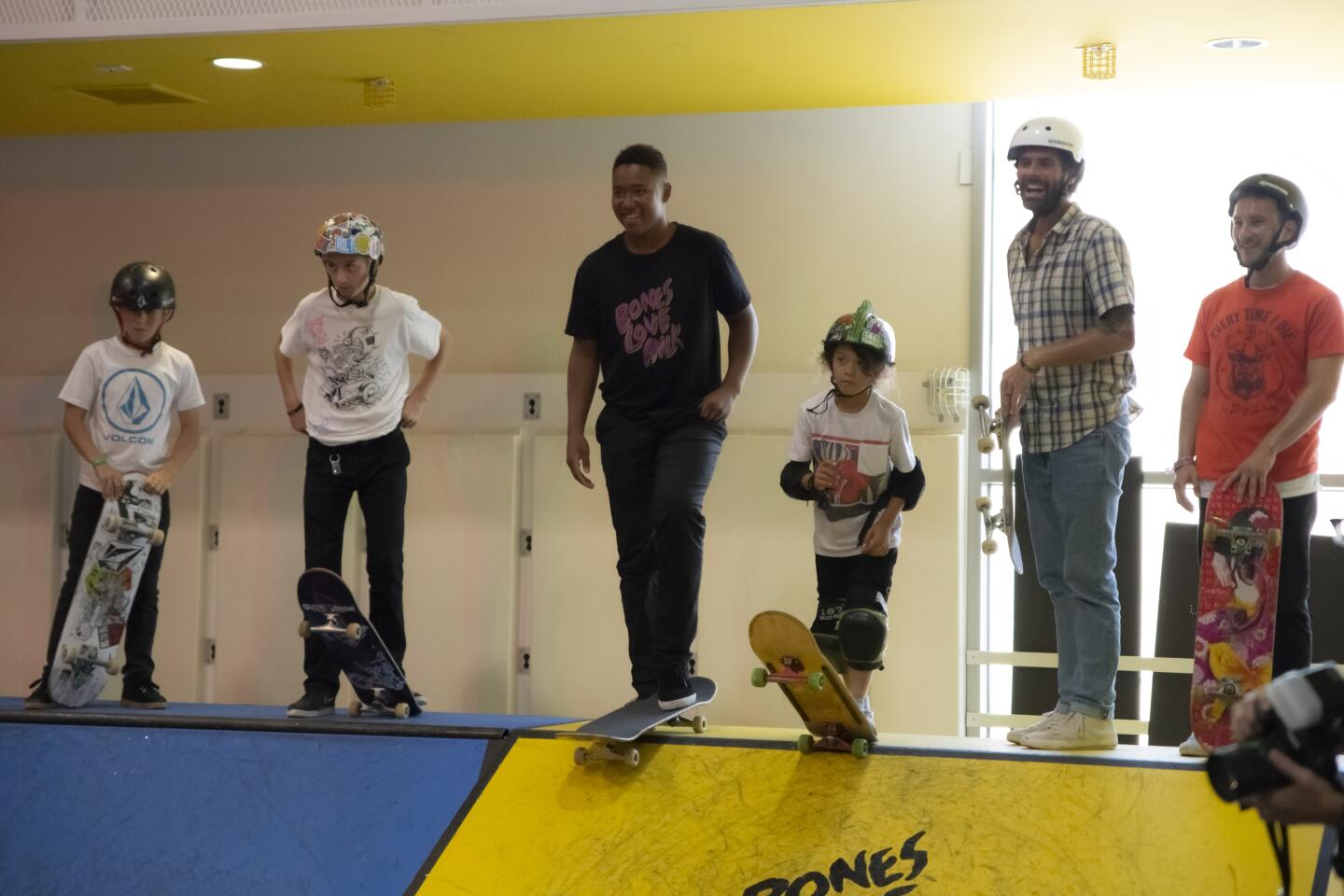 Pros Chris Cole and Cordano Russell skate with and offer tips to young visitors at a the United Collective's Bones Love Milk "Shredquarters"