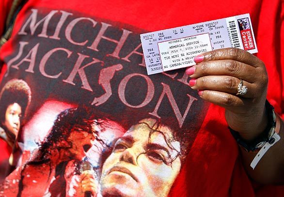 Michael Jackson fan Karen Thompson of Compton shows off her ticket to Tuesday's memorial service.