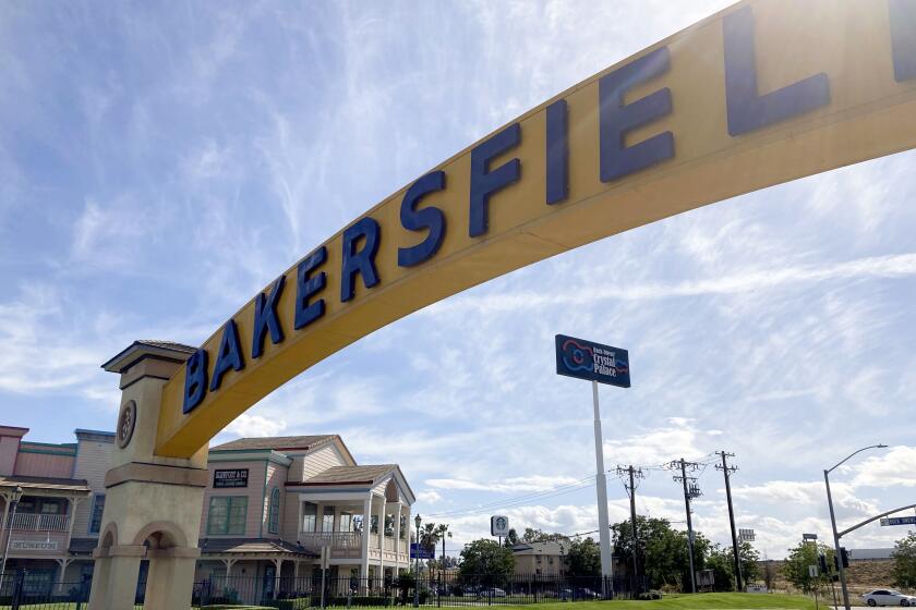 A sign for Bakersfield, Calif., is displayed over Sillect Avenue at Buck Owens Boulevard on April 20, 2022. House Republican leader Kevin McCarthy is a son of California’s Central Valley, a farming and oil-pumping heartland. It's a swath of rural conservatism amid California’s progressive politics and it's Donald Trump's slice of California. It's here that McCarthy launched his political rise. (AP Photo/Lisa Mascaro)