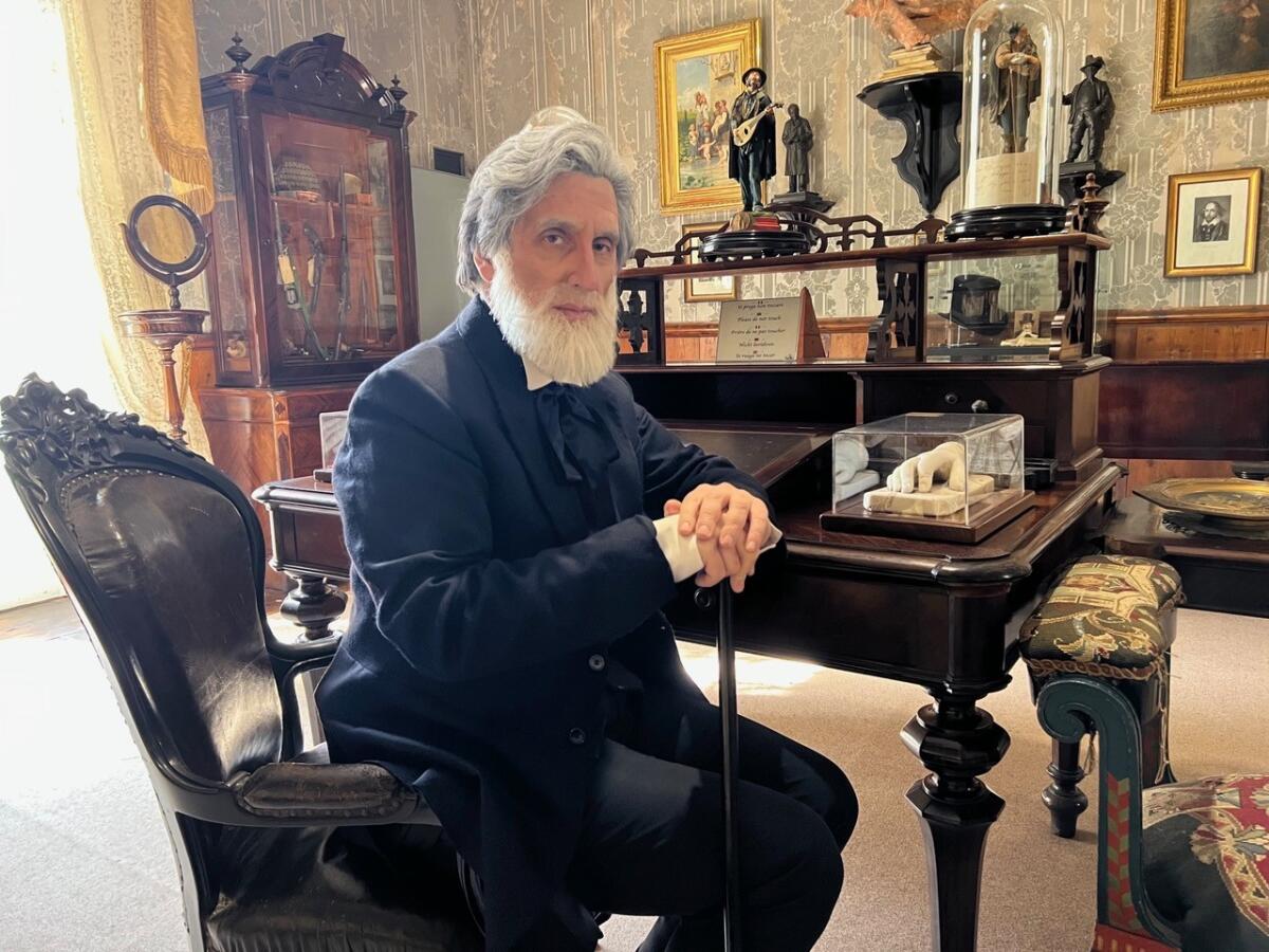 Hershey Felder as the elderly Giuseppe Verdi sits at the composer's own desk.