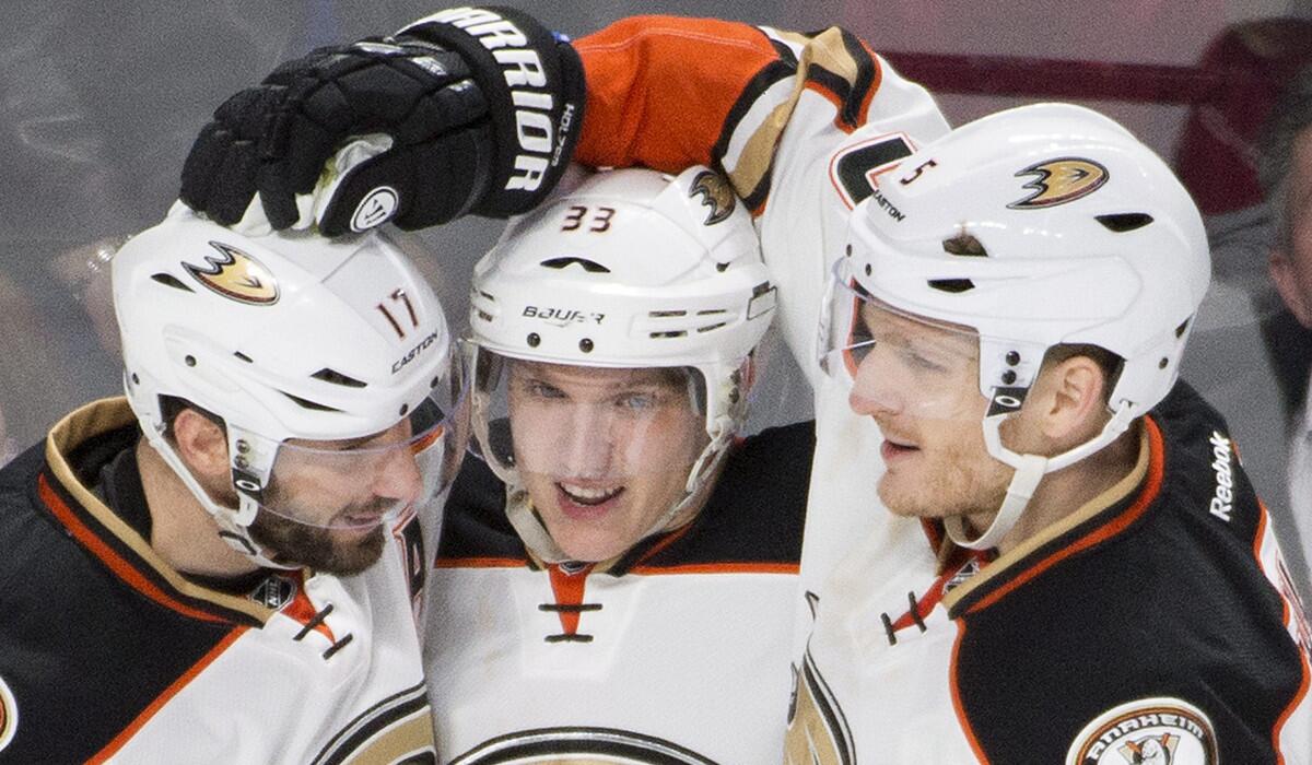 Ducks' Jakob Silfverberg, center, celebrates with teammates Ryan Kesler, left, and Korbinian Holzer after scoring against the Montreal Canadiens during second period Tuesday night.