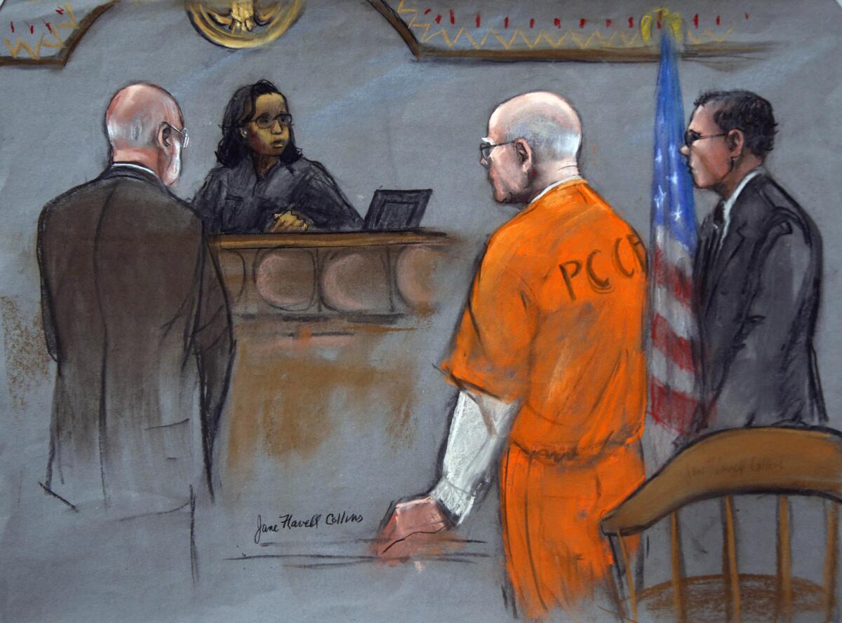 In this courtroom sketch, former Boston crime boss James "Whitey" Bulger, second from right, flanked by defense attorneys J.W. Carney Jr., left, and Hank Brennan, stands before Judge Denise Casper in federal court in Boston in November.