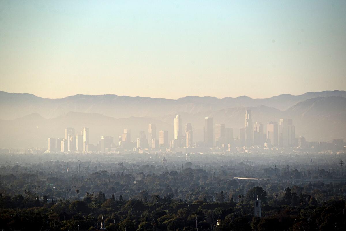A layer of smog blurs the Los Angeles skyline