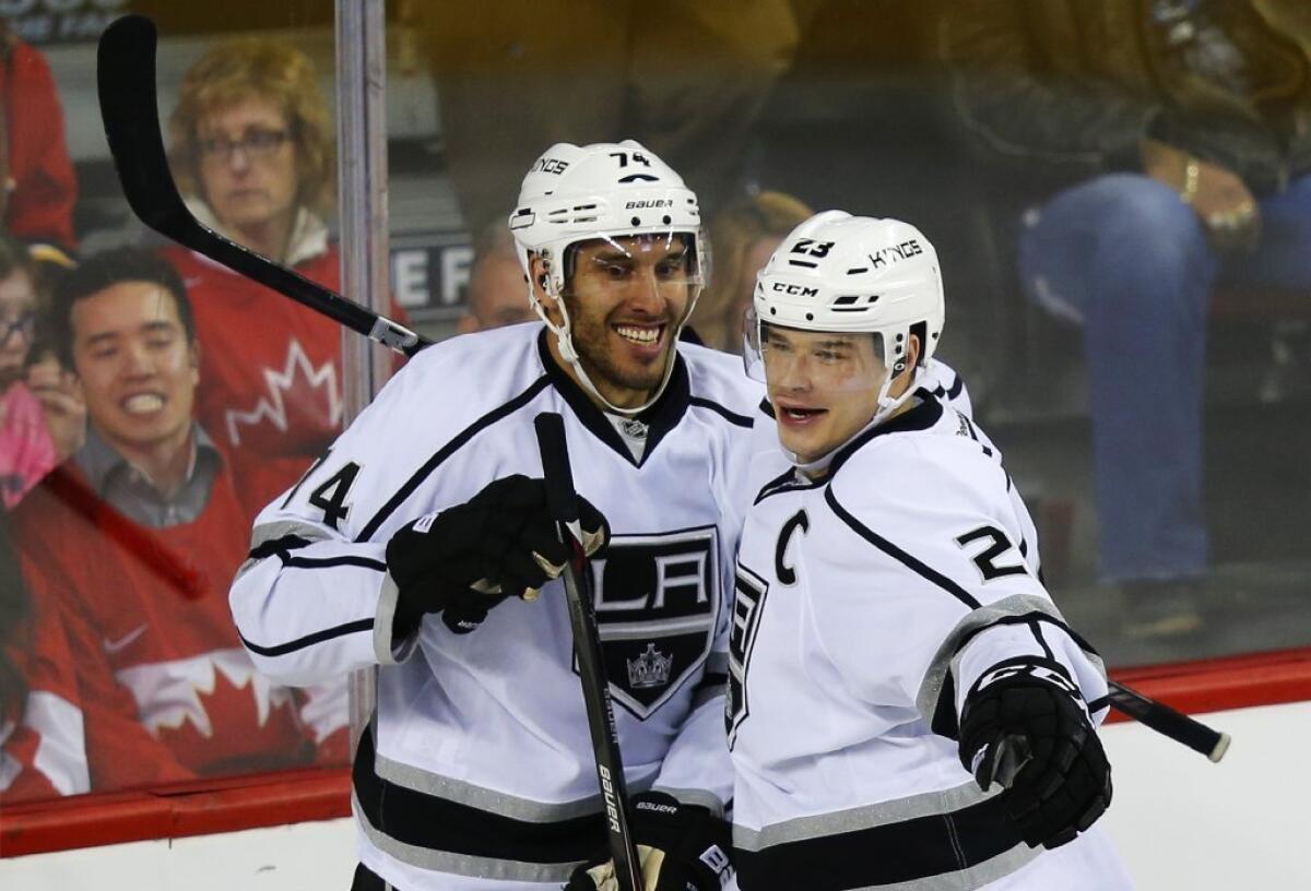 Dwight King, left, Dustin Brown and the rest of the Kings are charging toward the playoffs.