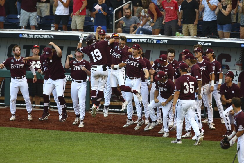 Mississippi State catcher Logan Tanner (19) celebrates with teammates after hitting a home run.