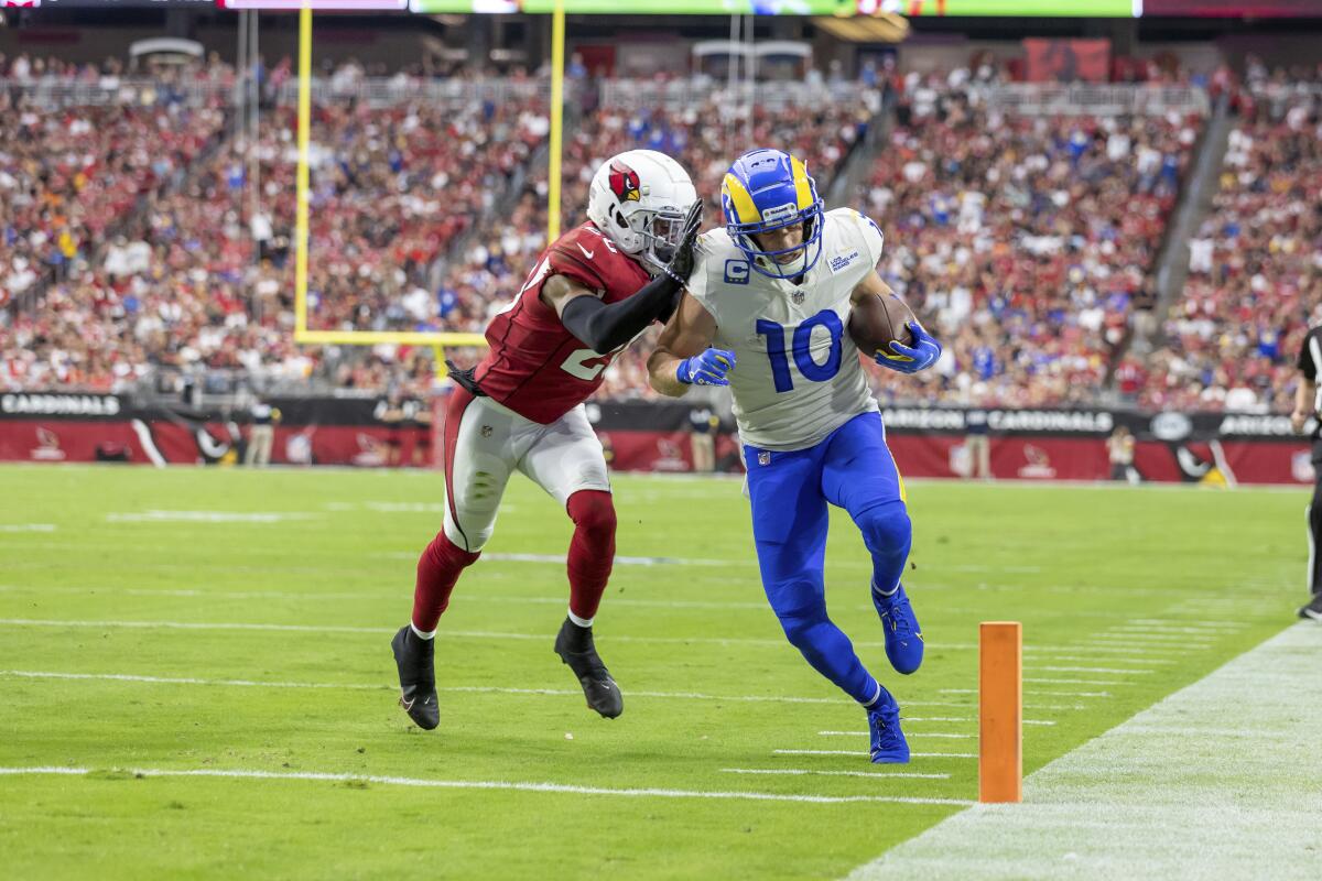 Rams wide receiver Cooper Kupp runs the ball for a touchdown against the Arizona Cardinals.