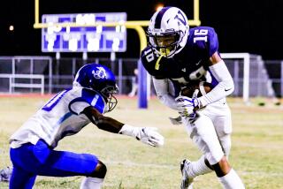 Venice's Joshua Coats has ball against Palisades defender.