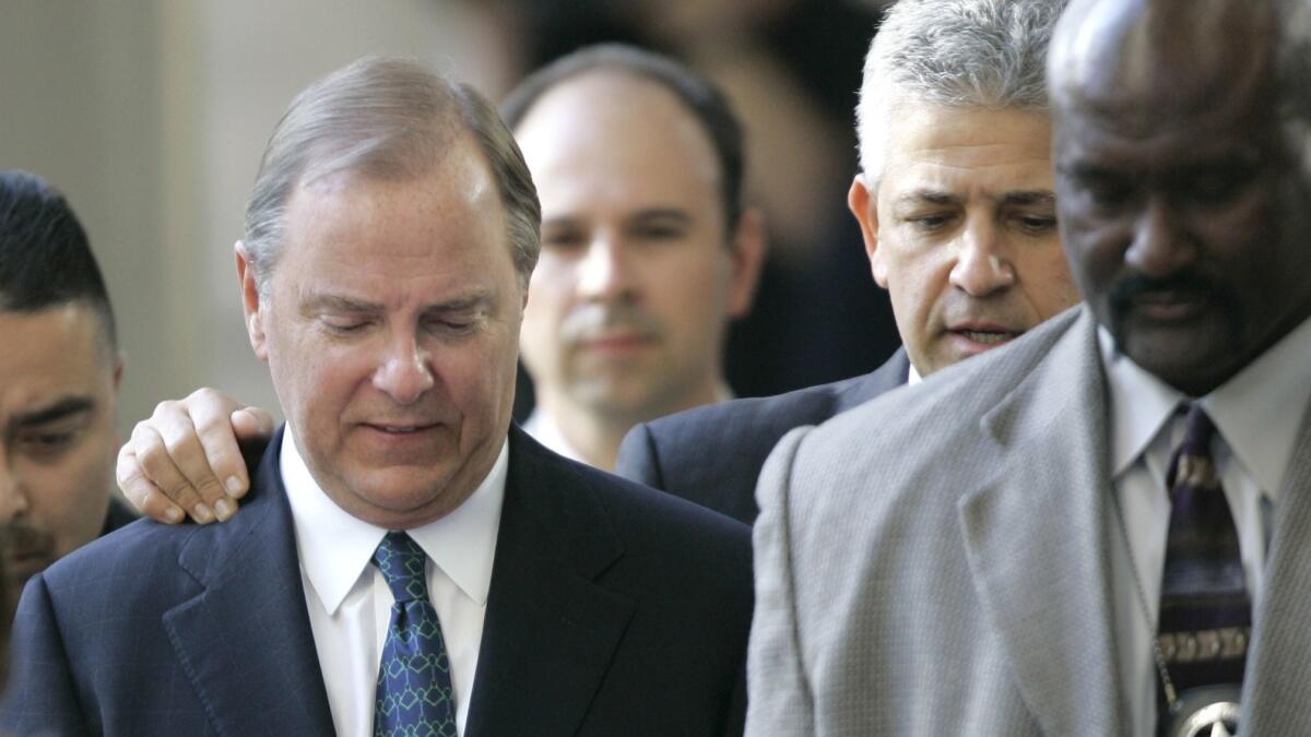 Jeffrey Skilling, left, was initially sentenced in 2006 to 24 years in prison. In 2013, the sentence was reduced.