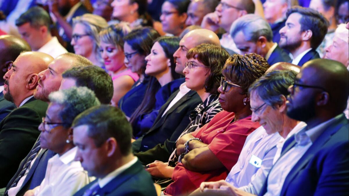Members of the audience listen to a Democratic primary debate hosted by NBC News in Miami on June 26.