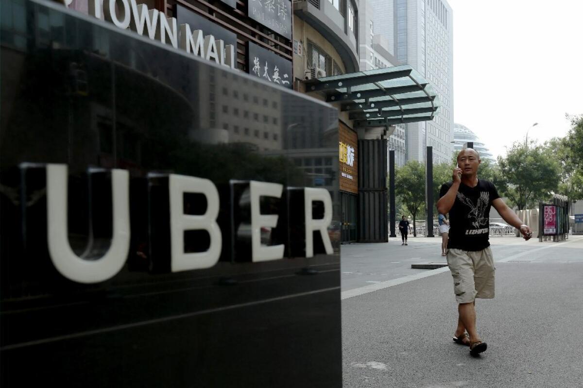 Uber said it was selling its China operations to its chief rival there, Didi Chuxing.