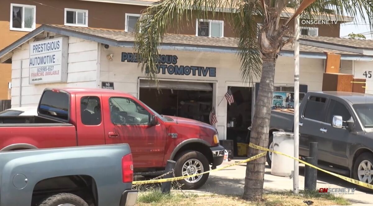 Police tape rings a National City business Monday following an early morning stabbing death inside the auto repair shop.