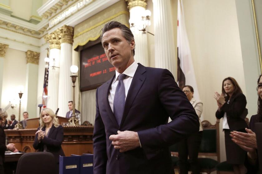 In this Tuesday, Feb. 12, 2019 photo, California Gov. Gavin Newsom receives applause after delivering his first state of the state address to a joint session of the legislature at the Capitol in Sacramento, Calif. Newsom said the state's consumers should get a "data dividend" from technology companies, like Google and Facebook, who are make by capitalizing on the personal data they collect. (AP Photo/Rich Pedroncelli)