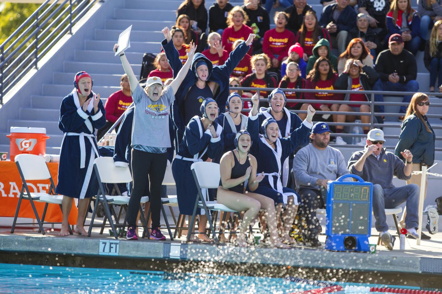 Newport Harbor girls' water polo team celebrates a 4-3 victory over Santa Barbara in the CIF Southern Section Division 2 championship game at Woollett Aquatics Center on Saturday, February 24.