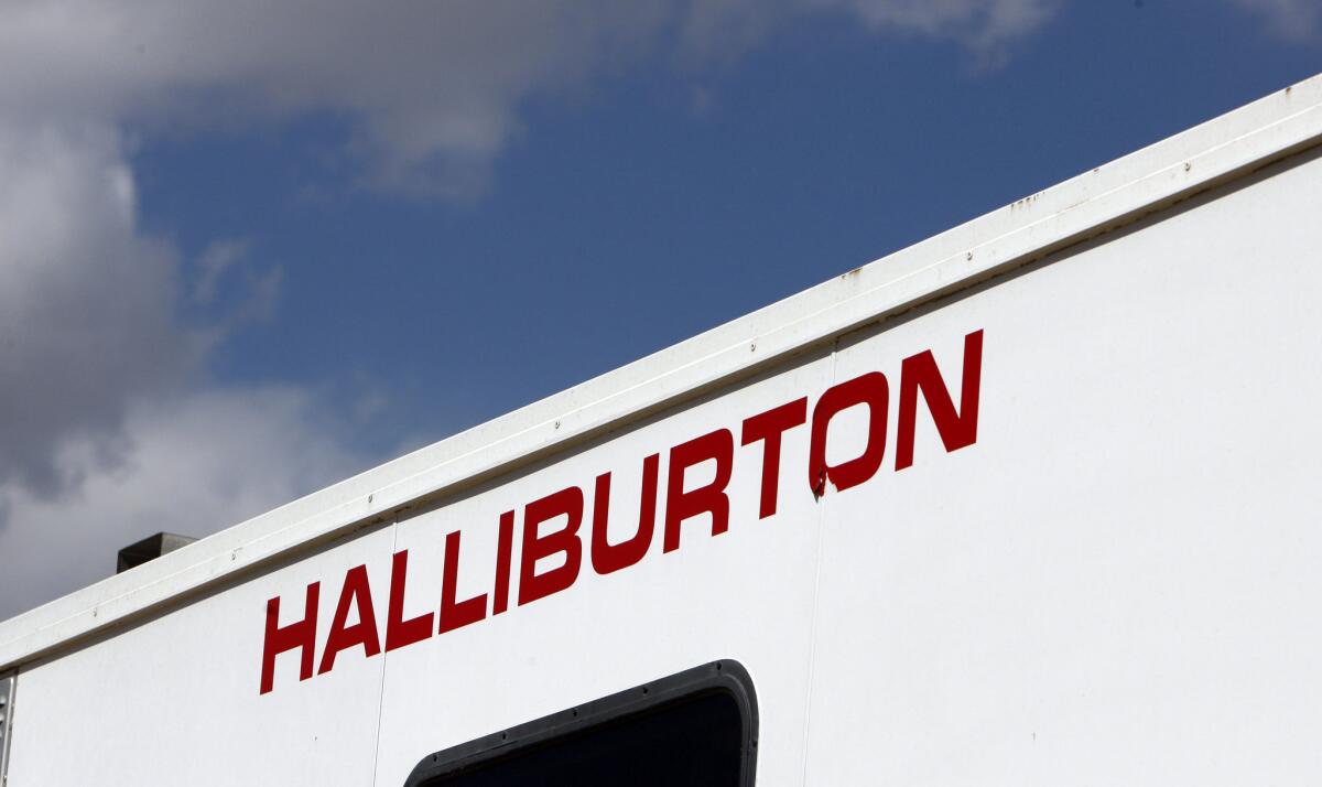 Halliburton anticipates laying off 6.5% to 8% of its global workforce, which amounts to 5,200 to 6,400 employees. Above, the Halliburton logo adorns the side of a machine at a natural gas production site in Rulison, Colo., in 2009.