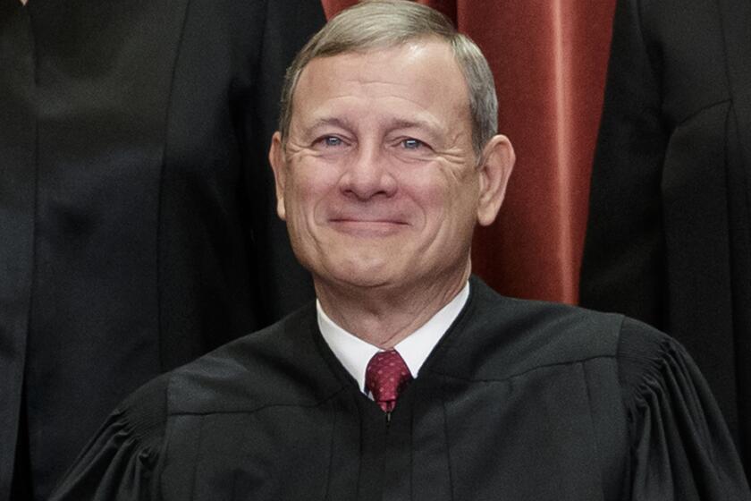 FILE - This Nov. 30, 2018, file photo shows Chief Justice of the United States, John Roberts, as he sits with fellow Supreme Court justices for a group portrait at the Supreme Court Building in Washington. Roberts spent the night in the hospital in June 2020 after he fell and injured his forehead, a Supreme Court spokeswoman confirmed Tuesday, July 7. (AP Photo/J. Scott Applewhite, File)