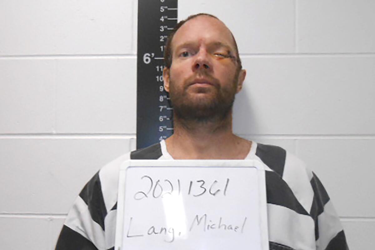 This undated photo provided by the Iowa Department of Public Safety shows Michael Lang. Lang, who is charged in the shooting death of Iowa Highway Patrol Sgt. Jim Smith during a standoff may have instigated the violent confrontation by goading an officer with whom he was angry to chase him, a police report shows. (Iowa Department of Public Safety via AP)