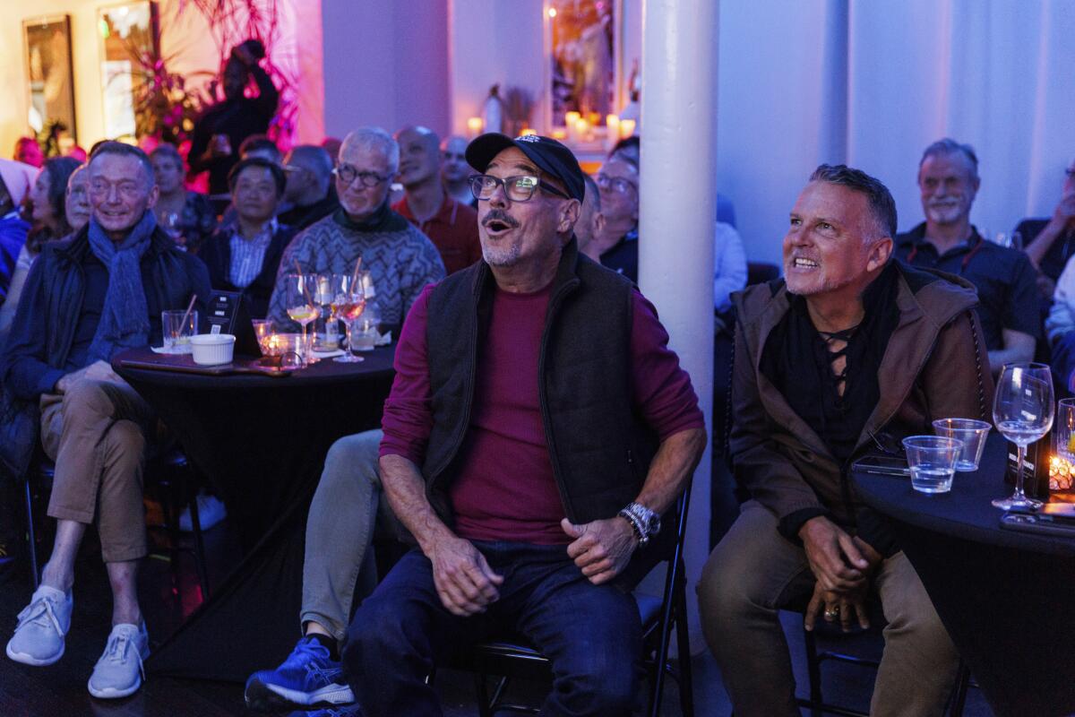 People react during t a watch party hosted by the Alice B. Toklas LGBTQ Democratic Club in San Francisco. 