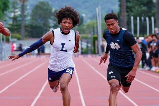 Zion Phelps of Loyola edges Emmanuel Pullins of Sherman Oaks Notre Dame in the 100 meters on Tuesday.