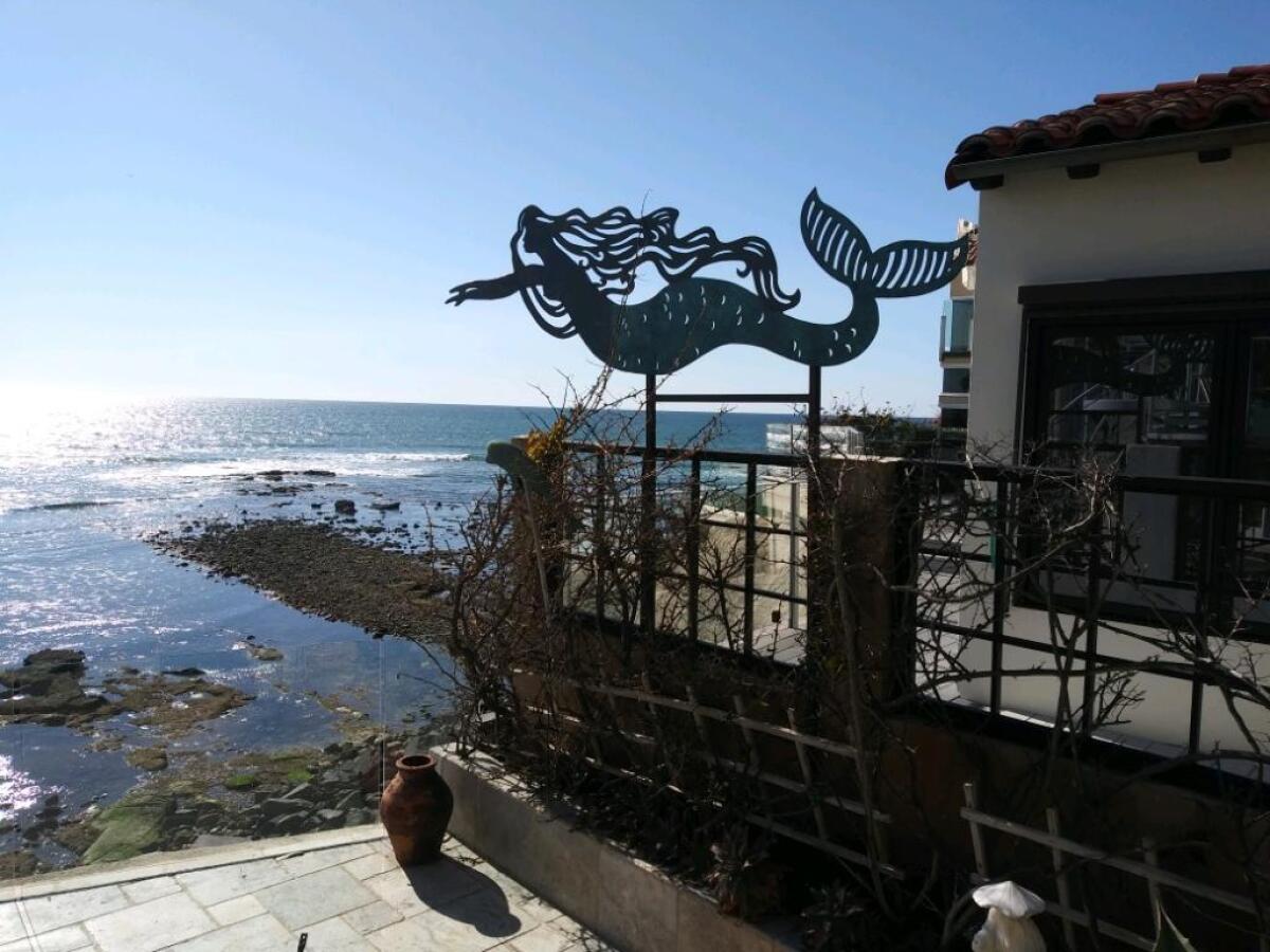 A mermaid sculpture by Carl Glowienke decorates the La Jolla home of Kevin and Jane Villani.