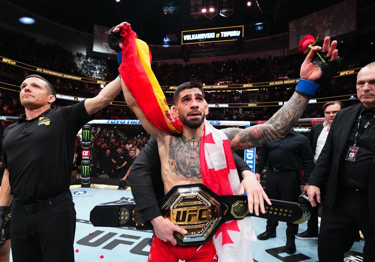 Ilia Topuria celebrates after his knockout victory against Alexander Volkanovski for the UFC featherweight title.