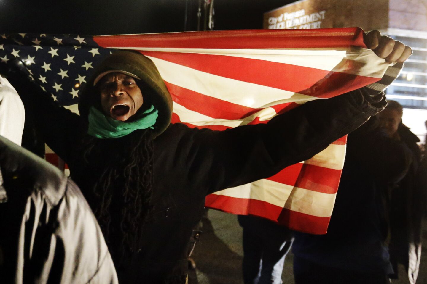 Protesters chant outside the Ferguson Police Department on Nov. 25.