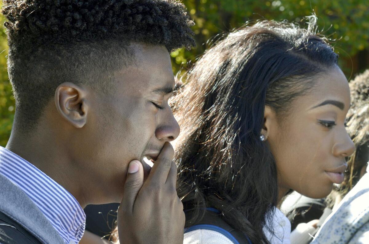 Members of the University of Missouri's Legion of Black Collegians and the Concerned Student 1950 supporters react after an on-campus protest, in Columbia, Mo. on Saturday.