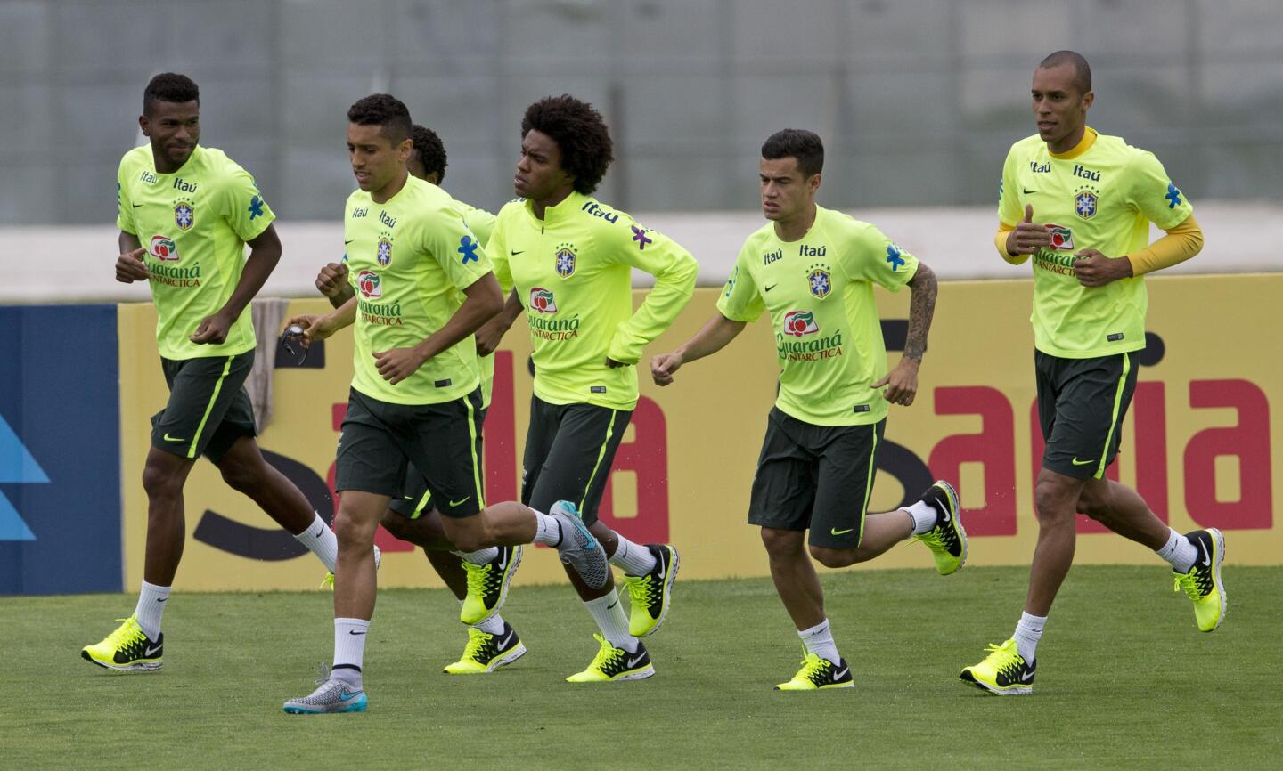 Brazil's soccer players, from left, Geferson, Marquinhos, Willian, Philippe Coutinho, and Miranda train ahead of Copa America 2015, in Teresopolis, Brazil, Tuesday, June 2, 2015.