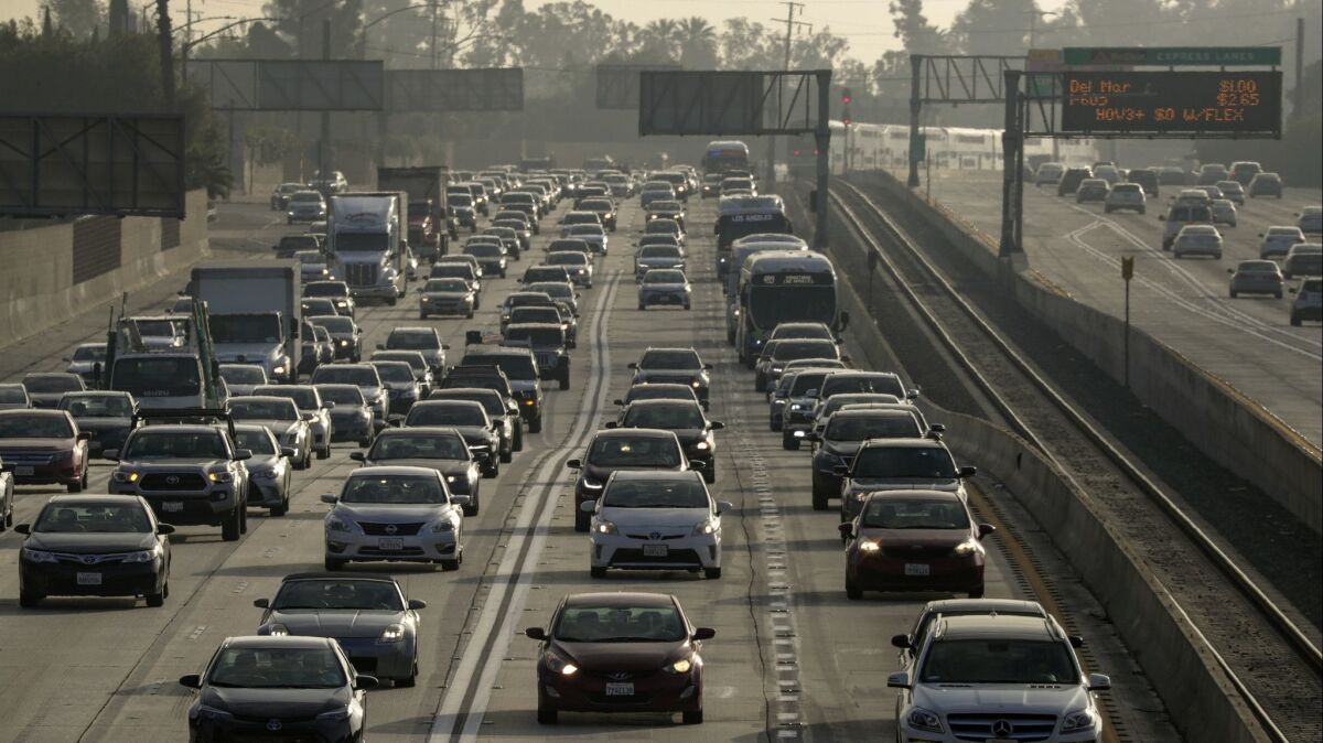 With congestion building in the toll lanes on the 110 and 10 freeways, Metro is ending the free access for commuters who drove alone in plug-in hybrids and electric vehicles.