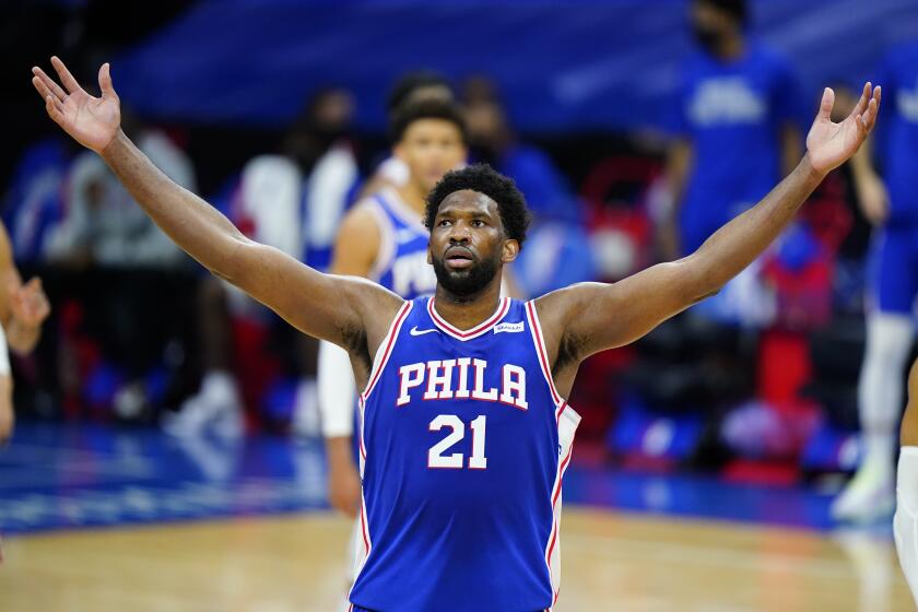 The 76ers' Joel Embiid celebrates his 50-point performance game against the Bulls on Feb. 19, 2021, in Philadelphia.