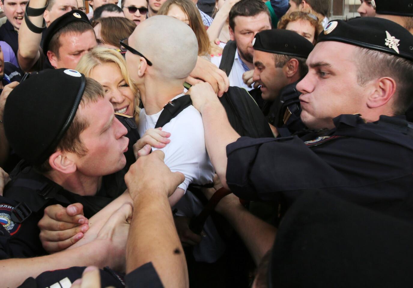 Riot police arrest a protester during a rally in support of opposition leader Alexei Navalny in downtown Moscow.