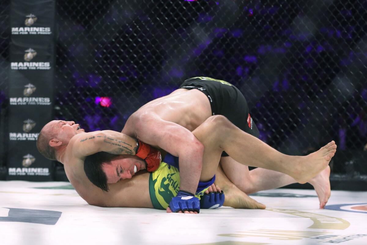 Wanderlei Silva grabs the neck of Chael Sonnen as they grapple during their fight at Bellator NYC.